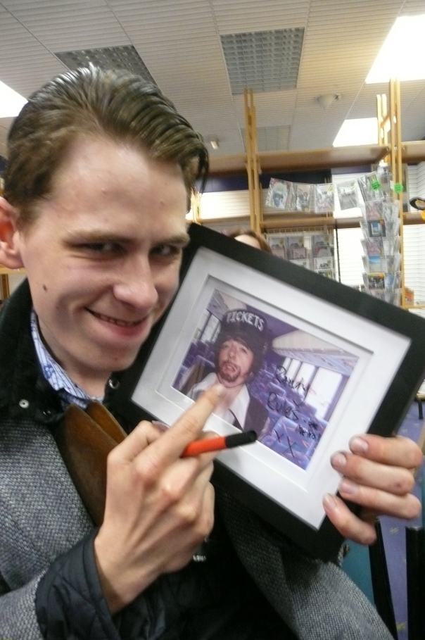 And he does! The lucky winner of a signed photo of the Ticket Inspector